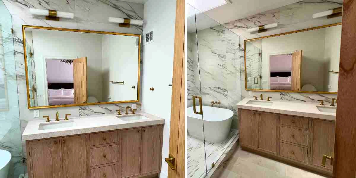 Renovated bathroom with a large black thin metal mirror over a marble vanity