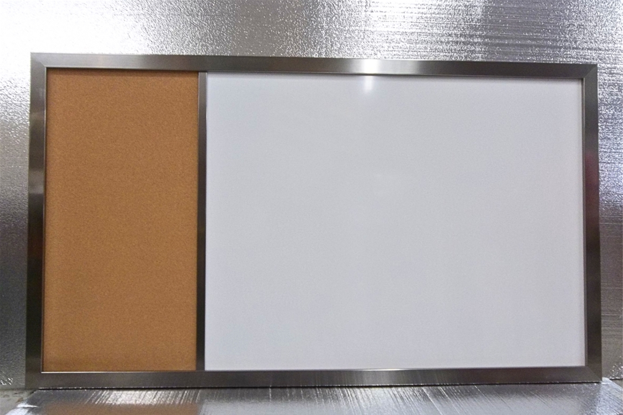 This board features a sleek metal frame, adding a modern and durable touch.